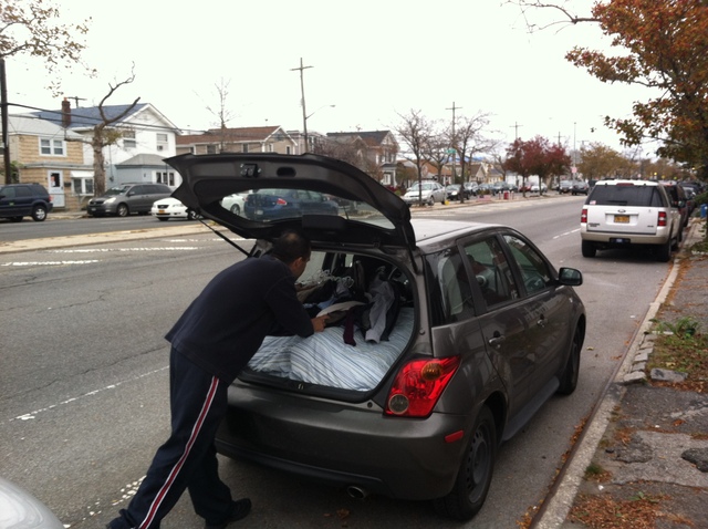 <p>Broad Channel resident Mike DelPino packs up his station wagon. He and his family are seeking temporary refuge on central Long Island on October 28, 2012.</p>
