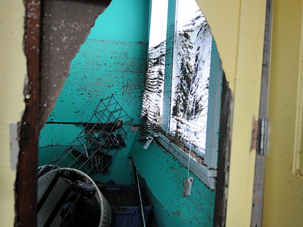 <p>Water from Hurricane Sandy left a line of dirt showing how high the water rose in the Staten Island home of Don Hallihan, 55, on Oct. 31, 2012.</p>