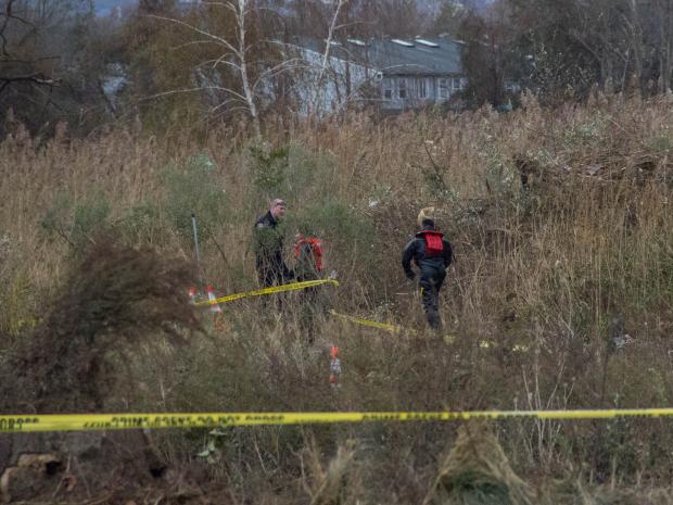 <p>Workers search for two missing boys in a marsh off of Father Capodanno Boulevard in South Beach after Hurricane Sandy, Oct. 31, 2012.</p>