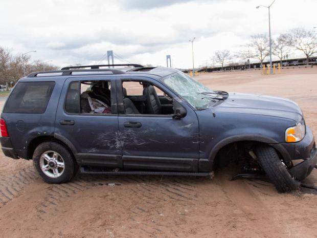 <p>A truck washed into the marsh off of Father Capodanno Boulevard, Staten Island, according to neighbors. Cops searched for two missing boys in the marsh on Oct. 31, 2012.</p>