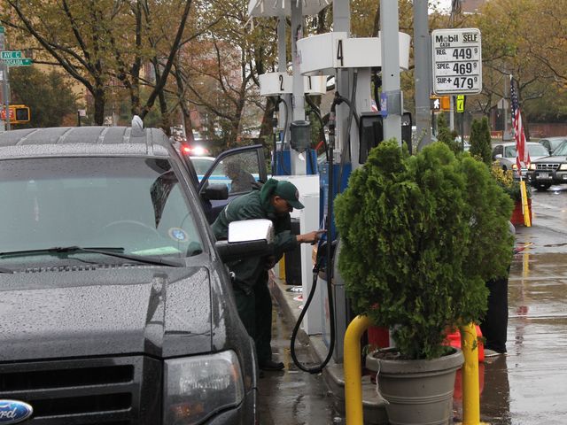<p>A man fills up his car with gas Wednesday afternoon.</p>
