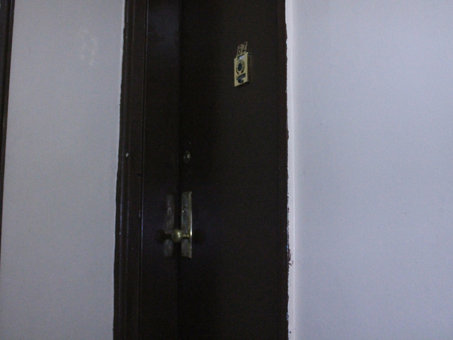 <p>The front door of the Forest Hills apartment of the police officer arrested Thursday October 25, 2012, and accused of plotting to cannibalize numerous women.&nbsp;</p>

