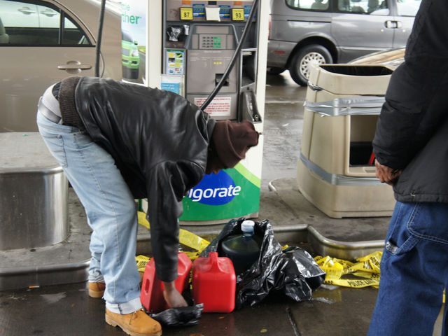 <p>A man fills up a gas can at a BP gas station at Bedford and Lincoln Place in Crown Heights.&nbsp;</p>
