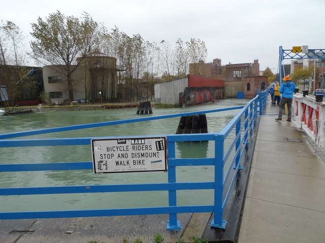 <p>Gowanus residents come out to look at the rising water levels in the canal as Hurricane Sandy bore down on the city.</p>
