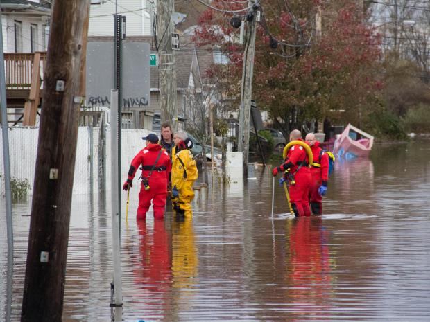 <p>Rescue workers search the homes on Grimsby Avenue, Staten Island, after Hurricane Sandy. Two elderly woman were found dead in their home on Grimsby Avenue, Oct. 31, 2012.</p>