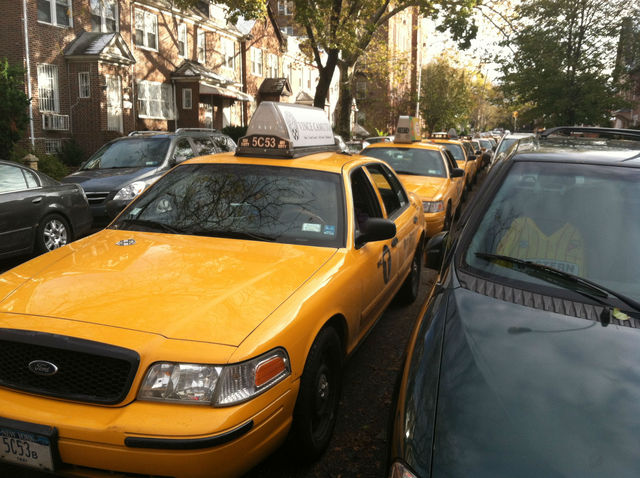 <p>Cabs lined up for blocks to wait for gas at a Jackson Heights Shell station, as locals were turned away.</p>
