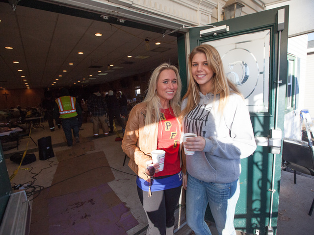 <p>(L-R) Kaitlin Doyle, 21, and Athena Dever, 26, local residents who have spent days helping out after Hurricane Sandy hit the Rockaways last week.</p>
