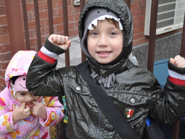<p>Giacomo DeJoseph, 5, stood in front of P.S. 132 next to his younger sister Eliana, 3, and cheered to return to kindergarten after a week without class.</p>
