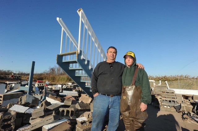 <p>Vincent and Jane Caravello at the remains of their home destroyed by Hurricane Sandy.</p>
