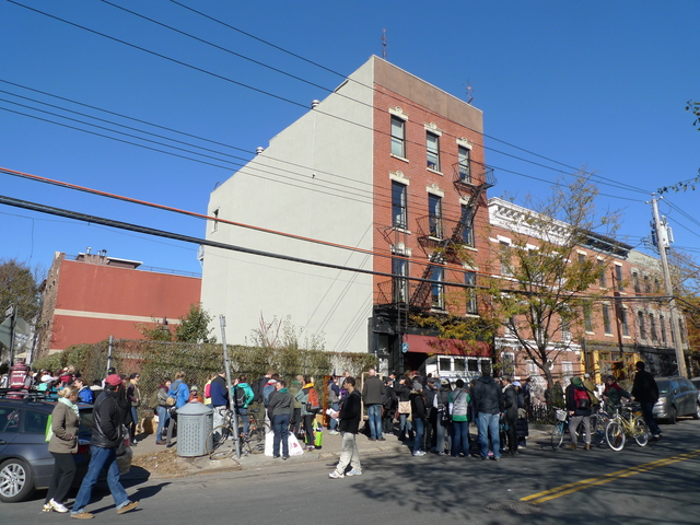 <p>A line of volunteers stretched around the block at the newly formed Hurricane Sandy clean-up group, Red Hook Recovery on Van Brunt Street, on Nov. 4, 2012.</p>
