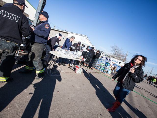 <p>Local residents and volunteers get hot refreshments outside the Rockaway Point Volunteer Fire Station in the Rockaways on Nov. 5, 2012.</p>
