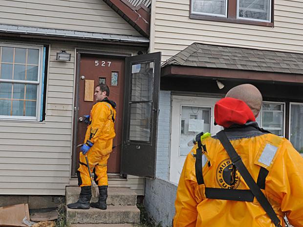 <p>FDNY workers going door to door to check on people on Midland Avenue after Hurricane Sandy hit, Oct. 31, 2012.</p>