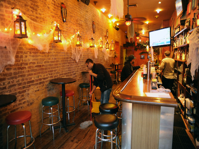<div>
	Mo Boulus sweeps the floor after opening 30 minutes after the lights came back up at Agozar Restaurant on the Bowery, Nov. 2, 2012. "We knew they were coming back up, we were ready!" he said with a smile on his face.</div>
