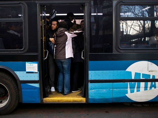 <p>Commuters pack a bus in New York City.</p>

