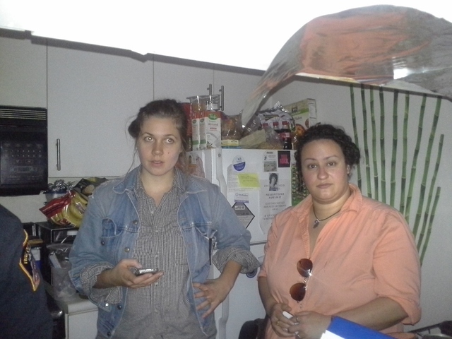 <p>Volunteers Katie Miles, left, and Mariam Bazeed, right, help power Nick Dupree's ventilator by swapping rechargeable batteries.</p>
