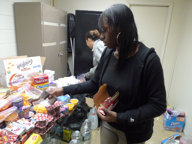 <p>Nicole Harris, a 31-year-old mom of three who lives in Red Hook Houses, helped sort donations at Calvary Baptist Church after Hurricane Sandy.</p>
