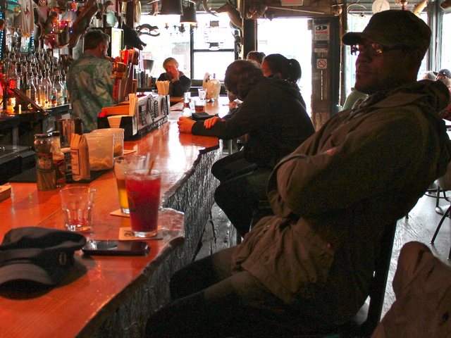 <p>Carroll Gardens resident Nixon Thelusmond sits at the bar at Red Hook Bait & Tackle ahead of Hurricane Sandy Sunday, Oct. 28, 2012.</p>
