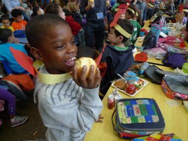 The school's 850 students — as well as parents, teachers and administrators — chowed down on an orchard's worth of apples Wednesday as they joined a citywide bid to set a world record for simultaneous apple consumption.
The city-sponsored apple eat-a-thon, called Big Apple Crunch , was aimed at promoting healthy eating by staging dozens of mass apple crunchings across the five boroughs. It was part of a nationwide event called Food Day .