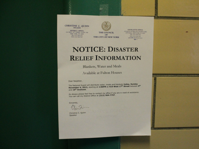 <p>A sign posted in Fulton announcing a food distribution on Sunday, Nov. 4, 2012.</p>
