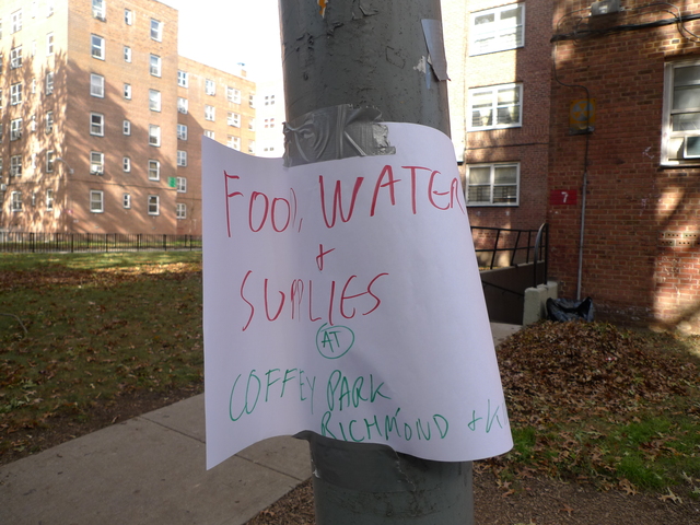 <p>A sign directs Red Hook Houses where to find food, water and other necessities after Hurricane Sandy.</p>
