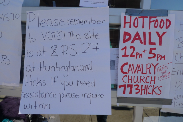 <p>Signs remind people to vote at Red Hook Initiative, a neighborhood nonprofit that's been coordinating volunteer relief efforts in the wake of Hurricane Sandy.</p>
