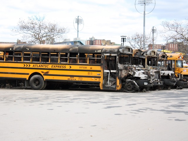 <p>School buses in a depot in Coney Island were torched after Hurricane Sandy.</p>
