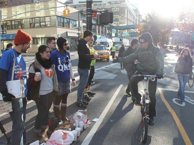 <p>Transportation Alternatives was giving out free coffee and donuts to cyclists and pedestrians at the entrance to the Queensboro Bridge on November 1, 2012.</p>
