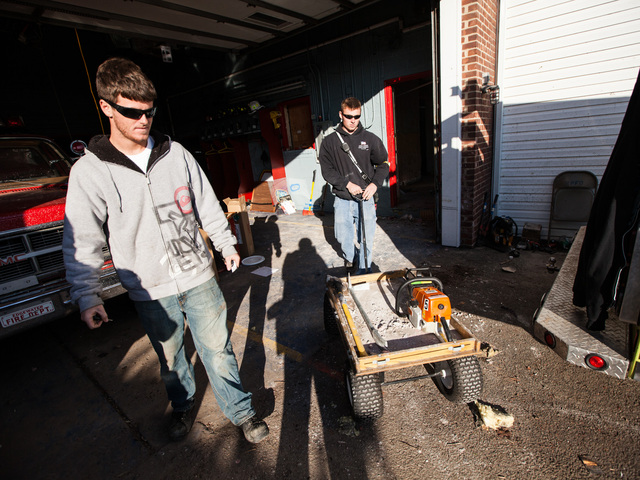 <p>Volunteer firefighters clear debris at the Rockaway Point Fire Station on Nov. 5th, 2012.</p>
