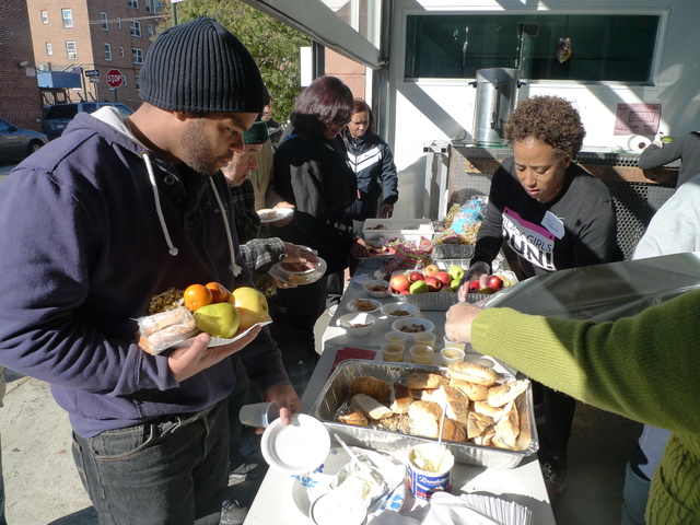 <p>Volunteers hand out meals at Red Hook Initiative following Hurricane Sandy. The local nonprofit has also been delivering meals to homebound residents affected by the hurricane.</p>
