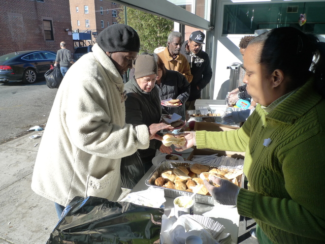 <p>Volunteers hand out meals at Red Hook Initiative following Hurricane Sandy. The local nonprofit has also been delivering meals to homebound residents affected by the hurricane.</p>
