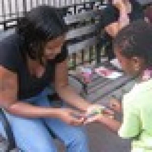 Aniyah rushes to show mom, Aisha Henry, 27, what she's made.