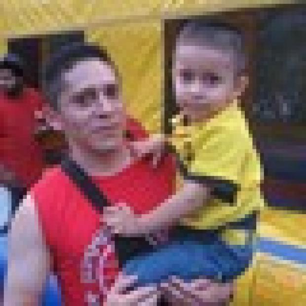 Alexis Espinoza, 3, and his dad, Nelson, 26, who live in Hell's Kitchen, said they were having a great time celebrating National Night Out.