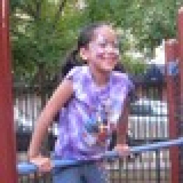 Jennifer Robayo, 7, was all smiles as she climbed the jungle gym in Hell's Kitchen Park.