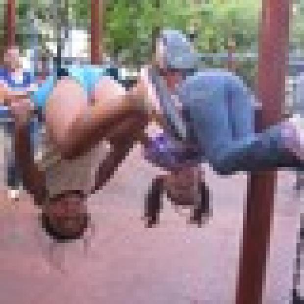 Friends Annjebica Jose and Jennifer Robayo, 7, who both live in Hell's Kicthen, show off their acrobatic skills.