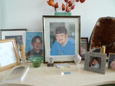 Photos of Sheri Perl's son Danny, who died in 2008, decorate her living room.