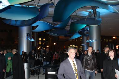  Sculptor Mark Davis under his installation "Healing Waters" at Lurie Children's Hospital. 
