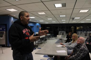  Sergeant Geno Rouse from the Mass Transit Unit talks to residents about 'L' safety during the holidays. 
