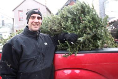  Tom Sonnleitner, 42, was one of 30 people who dropped their Christmas trees into the back of Steve Jensen's pickup truck for recycling over the weekend. 
