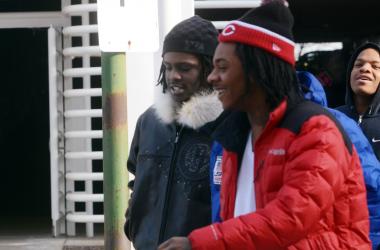 Chief Keef, brown jacket, walks into Juvenile Court on Jan. 15, 2013, with friend Capo.