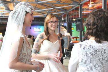  Here comes the faux brides, a walking fashion show at Indie Wed. 