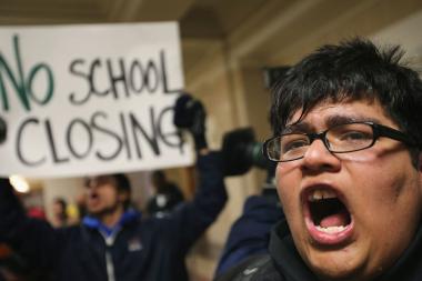  Alan Mares and other students protest proposed school closings outside Mayor Rahm Emanuel's office in March. 
