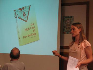  CMAP's Lindsay Bayley extolls the virtues of UCLA professor Donald Shoup's book, "The High Cost of Free Parking," at a meeting on parking issues in Wicker Park Wednesday evening. 
