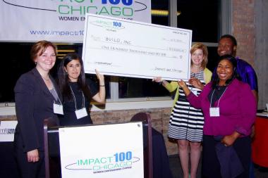  BUILD, Inc. receives the $100,000 check from the City Chapter of Impact 100 Chicago. Included in the photo are: Nicole Seidlitz, City Chapter Grants Chair; Georgy Ann Peluchiwski, City Chapter Co-founder; Allison Bacon, City Chapter Co-founder; Aramis Pates, BUILD, Inc. Youth; and Dr. Roslind Blasingame-Buford, BUILD, Inc. Executive Director. 
