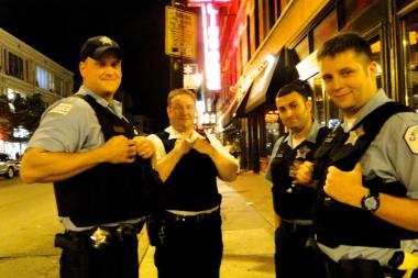  Police officers in Wicker Park wait for the crowds after the Blackhawk's Stanley Cup victory.
 