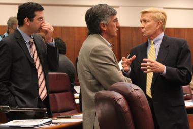  Ald. Bob Fioretti (right) talks with Aldermen Scott Waguespack and Ricardo Munoz during Wednesday's City Council meeting. All signed on to the ordinance to redistribute funds to CPS. 
