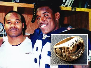  Former Notre Dame linebacker Jimmy Friday (l.) had his 1996 Orange Bowl and 1999 Gator Bowl rings returned to him by two Chicago police officers. The rings were stolen back in 2002. 
