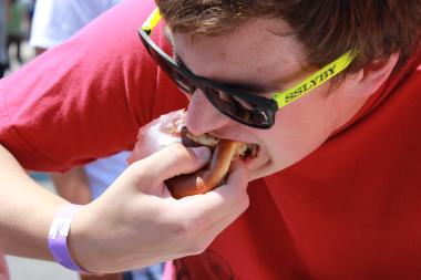  Matt Lohmeyer of Libertyville takes a bite of his pulled-pork sandwich at the 2013 Taste of Chicago. 
