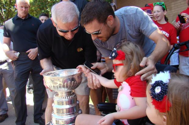  Four-year-old Cammy Babiarz got the chance Saturday to touch the Stanley Cup when John McDonough brought the Cup to Edison Park. 
