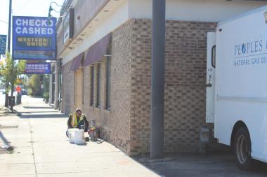  A worker from People's Gas installs a new gas meter outside Elly's Pancake House's new location on Milwaukee Avenue near Foster and Central avenues. 
