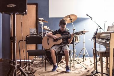  A 32Forty music student performs during an opening day recital. 